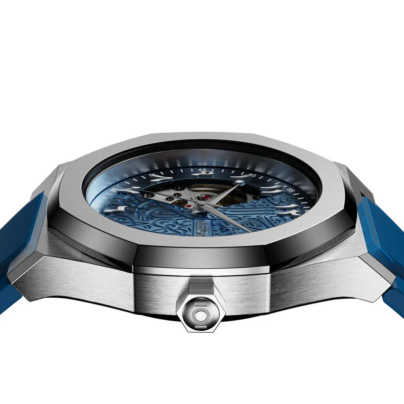 Side profile of a men’s automatic watch with a blue case and crown details